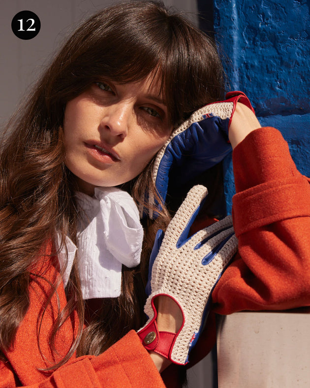 Woman wearing crochet-back union jack leather driving gloves in the city