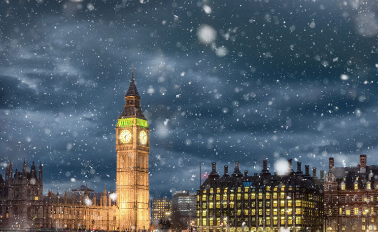 Winter Sale Graphic - Big Ben tower illuminated at night with snow falling in London